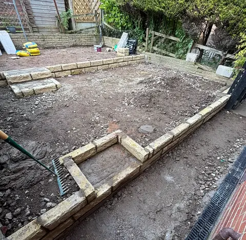 The same garden during the work, cleared back with new walling forming the two levels